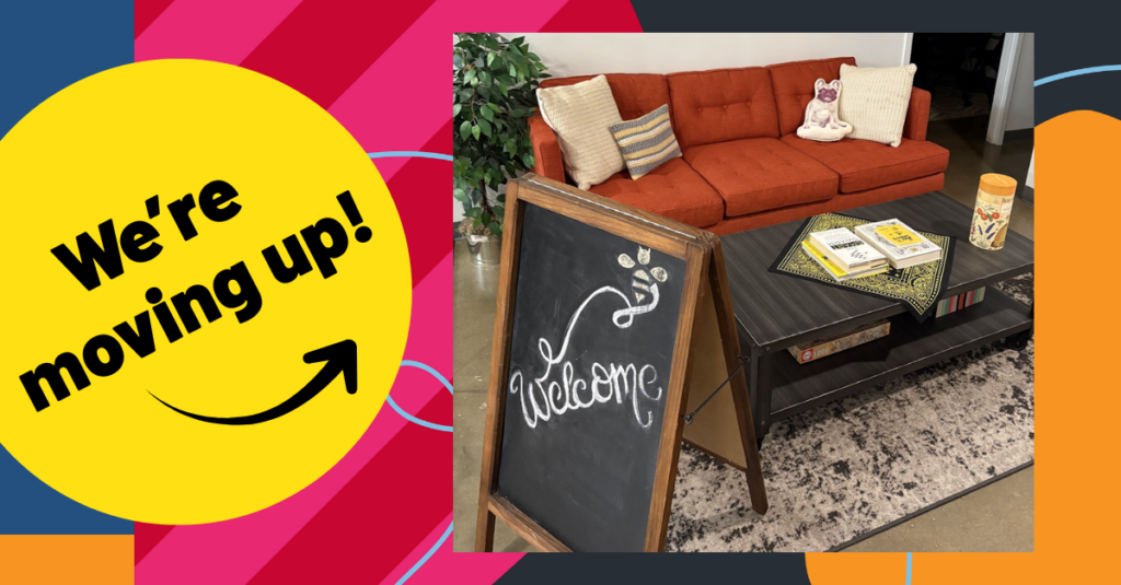 A cozy lounge with an orange sofa, pillows, and stuffed toy. In front is a chalkboard reading “Welcome,” a coffee table with books, and a yellow circle overlay saying “We’re moving up!”—plus Fall updates from Beekeeper Group.