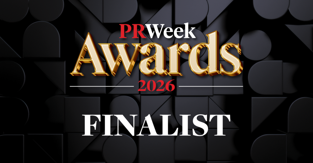 A graphic with PRWeek Awards 2026 FINALIST in bold gold and white text against a dark geometric background, celebrating 15 years with the Bees.