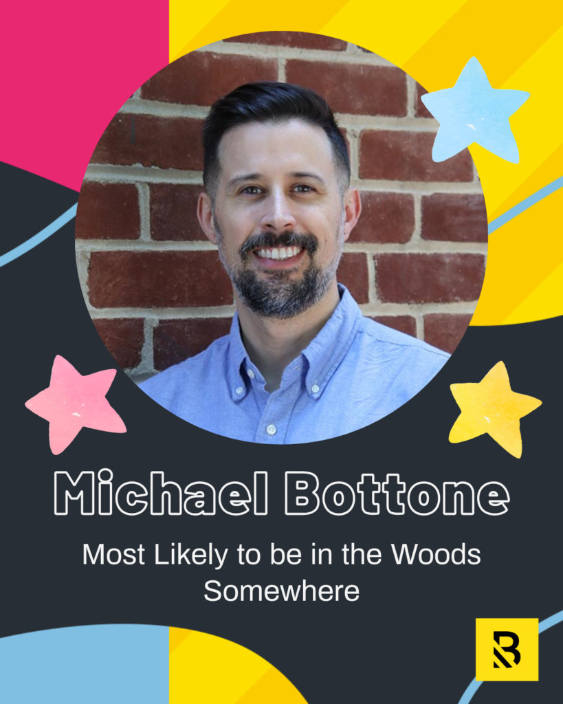 A man with dark hair and a beard smiles in front of a brick wall. Playful stars, bright colors, and text read, “Michael Bottone – Most Likely to be in the Woods Somewhere,” as part of our Staff Superlatives in Inside the Hive.